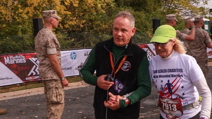 Cynthia Gregory, a runner in the marathon, finishes the 40th Marine Corps Marathon Oct. 25 at the Iwo Jima Memorial in Arlington, Va. Gregory finished the 26.2 miles in seven hours, seven minutes and 21 seconds and ranked 427th in her division.