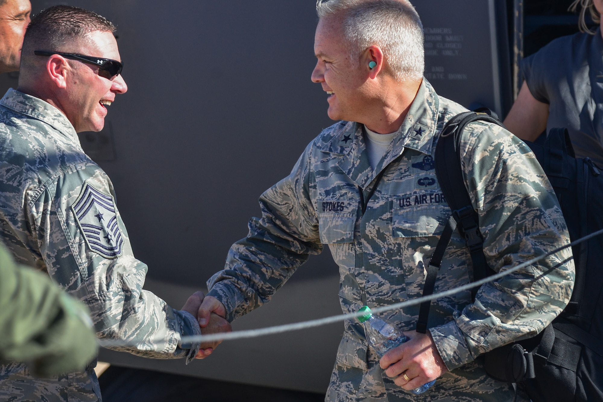 Chief Master Sgt. Randy Scanlan, 27th Special Operations Wing command chief, greets Brig. Gen. John Stokes, Air Force Special Operations Command mobilization assistant to the commander, Oct. 13, 2015 at Cannon Air Force Base, N.M. Senior leaders from across AFSOC gathered last week at Cannon for the Fall Commando Rally.(U.S. Air Force photo/Airman 1st Class Shelby Kay-Fantozzi)