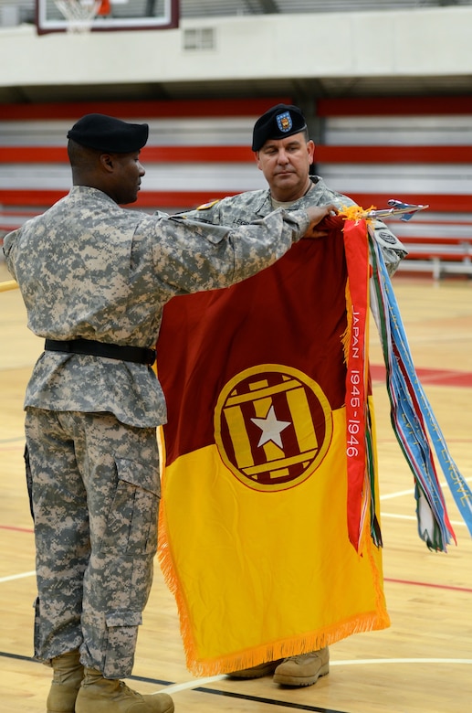 Brig. Gen. Norman Green, 377th Theater Sustainment Command Deputy Commander, uncases the colors of the 3d Transportation Brigade (Expeditionary) with the unit’s top Non Commissioned Officer, Command Sgt. Maj. Joseph Legra, during an activation and change of command ceremony on Fort Belvoir, Va.   (U.S. Army photo by 1st Lt. William Roland)