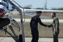 Col. Matt Isler, 12th Flying Training Wing commander, welcomes Maj. Tyler Ellison, U.S. Air Force Air Demonstration Squadron “Thunderbirds” operations officer to Joint Base San Antonio-Randolph Oct. 26, 2015. The Thunderbirds are scheduled to perform at the JBSA Air Show and Open House Oct. 31 and Nov. 1.