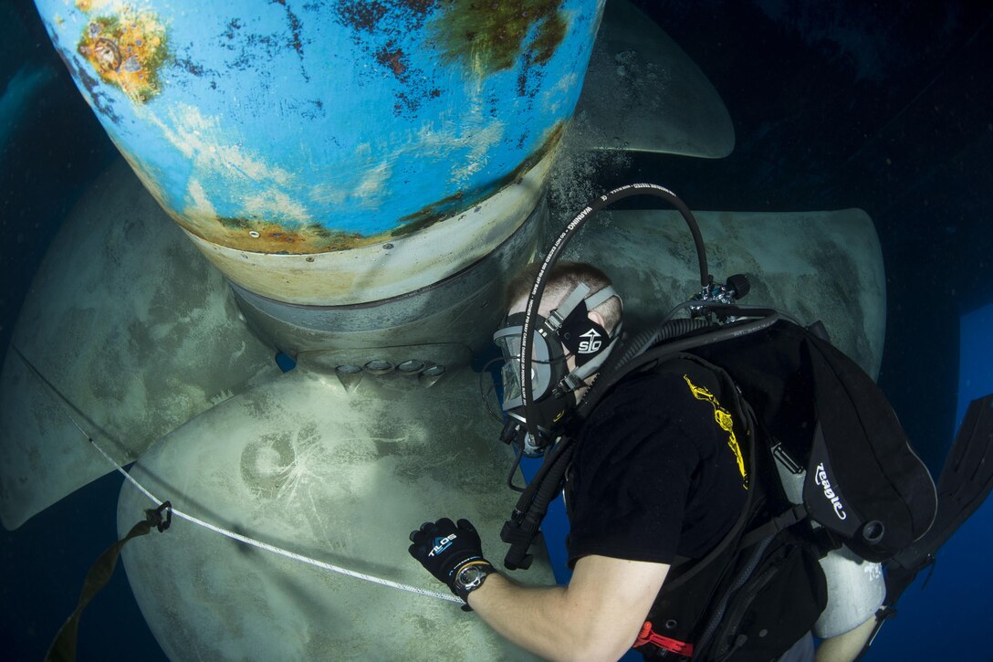 U.S. Navy diver David Close conducts a ship's husbandry dive to inspect running gear in the U.S. 5th Fleet Area of Operations, Oct. 21, 2015. Close is assigned to Commander, Task Group 56.1. The task group conducts mine countermeasures, explosive ordnance disposal, salvage-diving and force protection operations throughout the U.S. 5th Fleet area of operations. U.S. Navy photo by Petty Officer 2nd Class Wyatt Huggett
