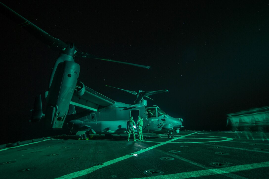 Crew members of an Air Force CV-22 Osprey prepare to conduct deck landing qualifications aboard Whidbey Island-class dock landing ship USS Rushmore in the Arabian Sea, Oct. 20, 2015. The Rushmore is part of the Essex Amphibious Ready Group and with the embarked 15th Marine Expeditionary Unit, supports maritime security operations and theater security cooperation efforts in the U.S. 5th Fleet area of operations. U.S. Navy photo by Petty Officer 3rd Class Chelsea Troy Milburn