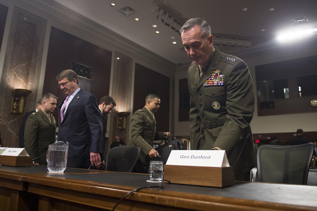 Defense Secretary Ash Carter, left, and Marine Corps Gen. Joseph F. Dunford Jr., chairman of the Joint Chiefs of Staff, prepare to testify on U.S. military strategy in the Middle East before the Senate Armed Services Committee in Washington, D.C., Oct. 27, 2015. DoD photo by U.S. Navy Petty Officer 2nd Class Dominique A. Pineiro