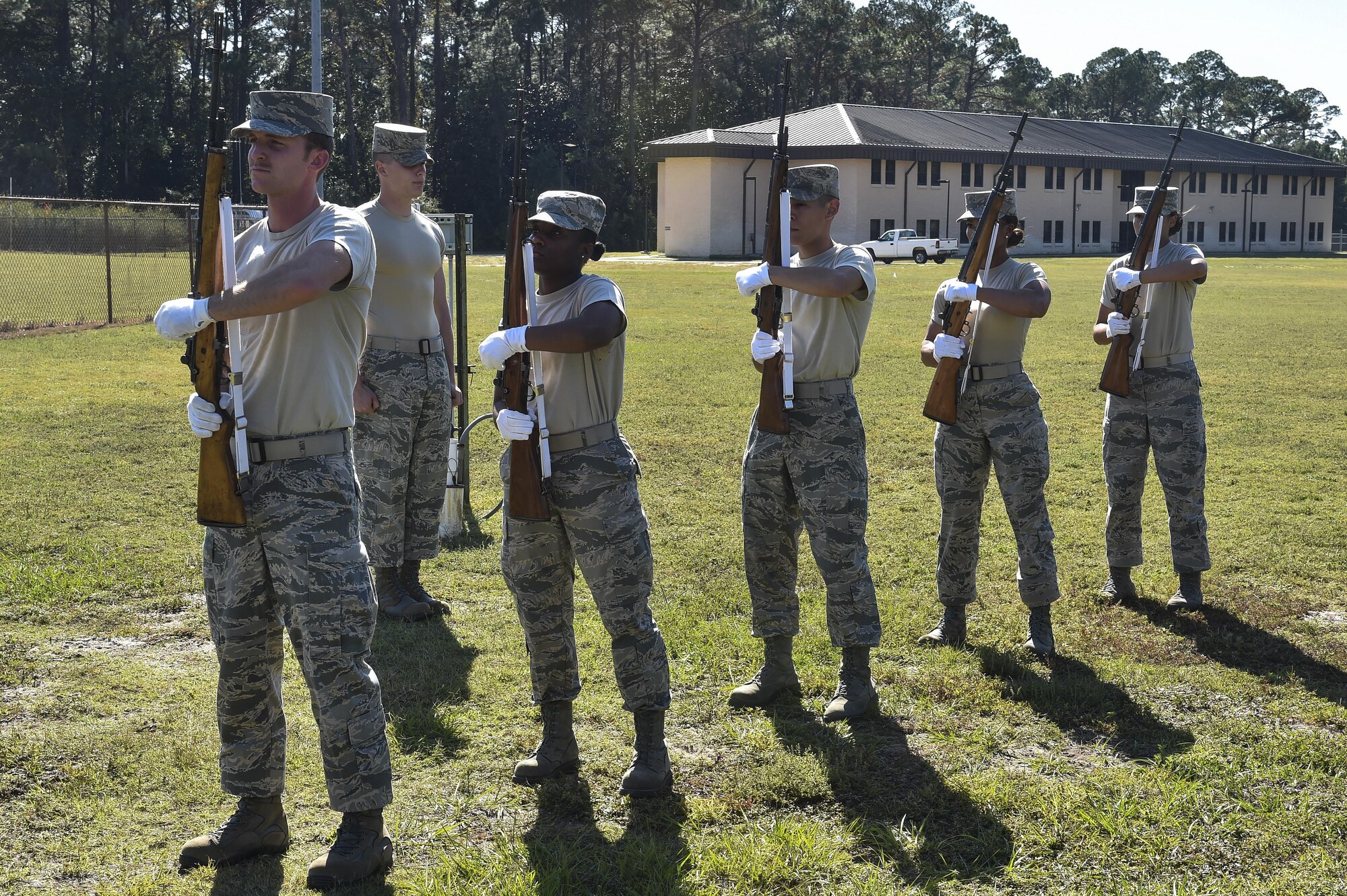 Base honor guard members learn proper firing party procedures during training at Hurlburt Field, Fla., Oct. 15, 2015. The U.S. Air Force Honor Guard mobile training team from Bolling Air Force Base, Washington, D.C., came to Hurlburt Field to teach a seven-day course on standardized basic protocol, honors and ceremony procedures. (U.S. Air Force photo by Senior Airman Jeff Parkinson)
