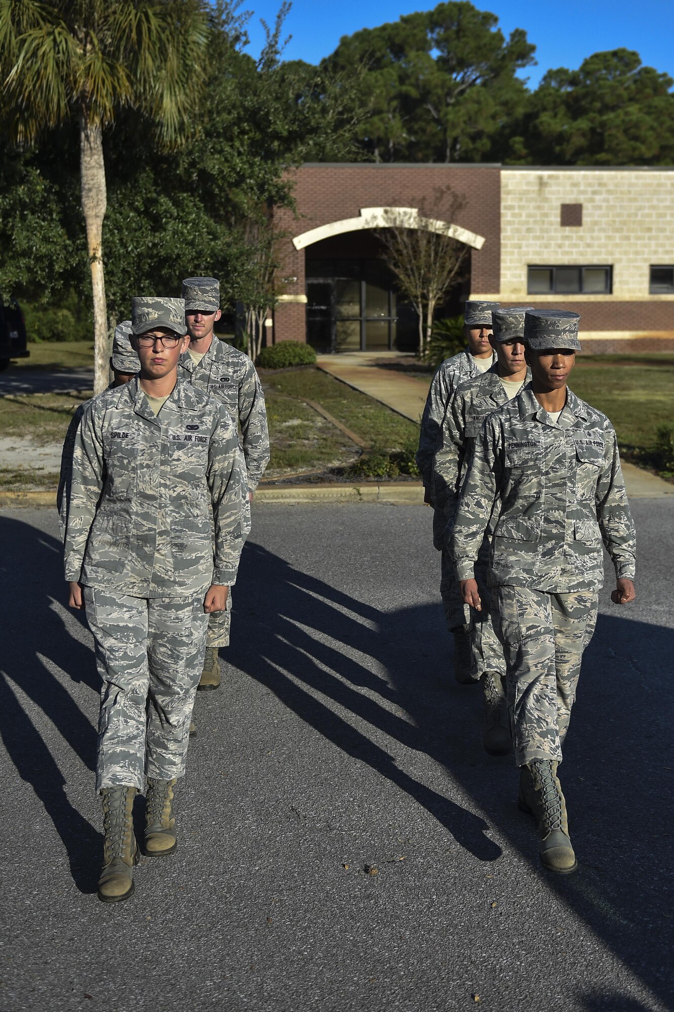 Staff Sgt. April Spilde, left, U.S. Air Force Honor Guard mobile training team instructor, leads a practice formation of pallbearers during training at Hurlburt Field, Fla., Oct. 16, 2015. The U.S. Air Force Honor Guard mobile training team traveled from Bolling Air Force Base, Washington, D.C., to train 15 base honor guard members from Hurlburt Field, Eglin AFB and Tyndall AFB, Fla. The seven-day course totaled 80 hours of instruction focused on standardized flag presentation, firing party and pallbearer techniques. (U.S. Air Force photo by Senior Airman Jeff Parkinson)
