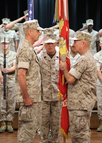 Lieutenant Gen. Kenneth F. McKenzie, Jr., prepares to relinquish command of U.S. Marine Corps Forces Central Command to Lt. Gen. Dave “Smoke” Beydler during a change of command ceremony at the Surf’s Edge aboard Air Force Base MacDill, Oct. 27, at 9:00 a.m. Sergeant Maj. Larry Fineran, MARCENT sergeant major, salutes after passing the MARCENT battle colors to McKenzie, who in turn would hand the colors over to Beydler symbolizing the transfer of command.  General Robert B. Neller, 37th Commandant of the Marine Corps, presided over the ceremony.