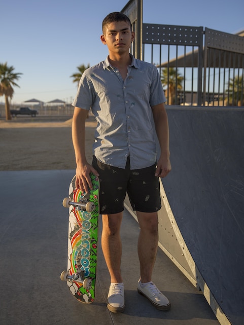 Pfc. Ariel Robins, student, Marine Corps Electronics-Communication School, takes a break from skateboarding at the Combat Center's skate park, Oct. 22, 2015. (Official Marine Corps photo by Lance Cpl. Connor Hancock/Released)