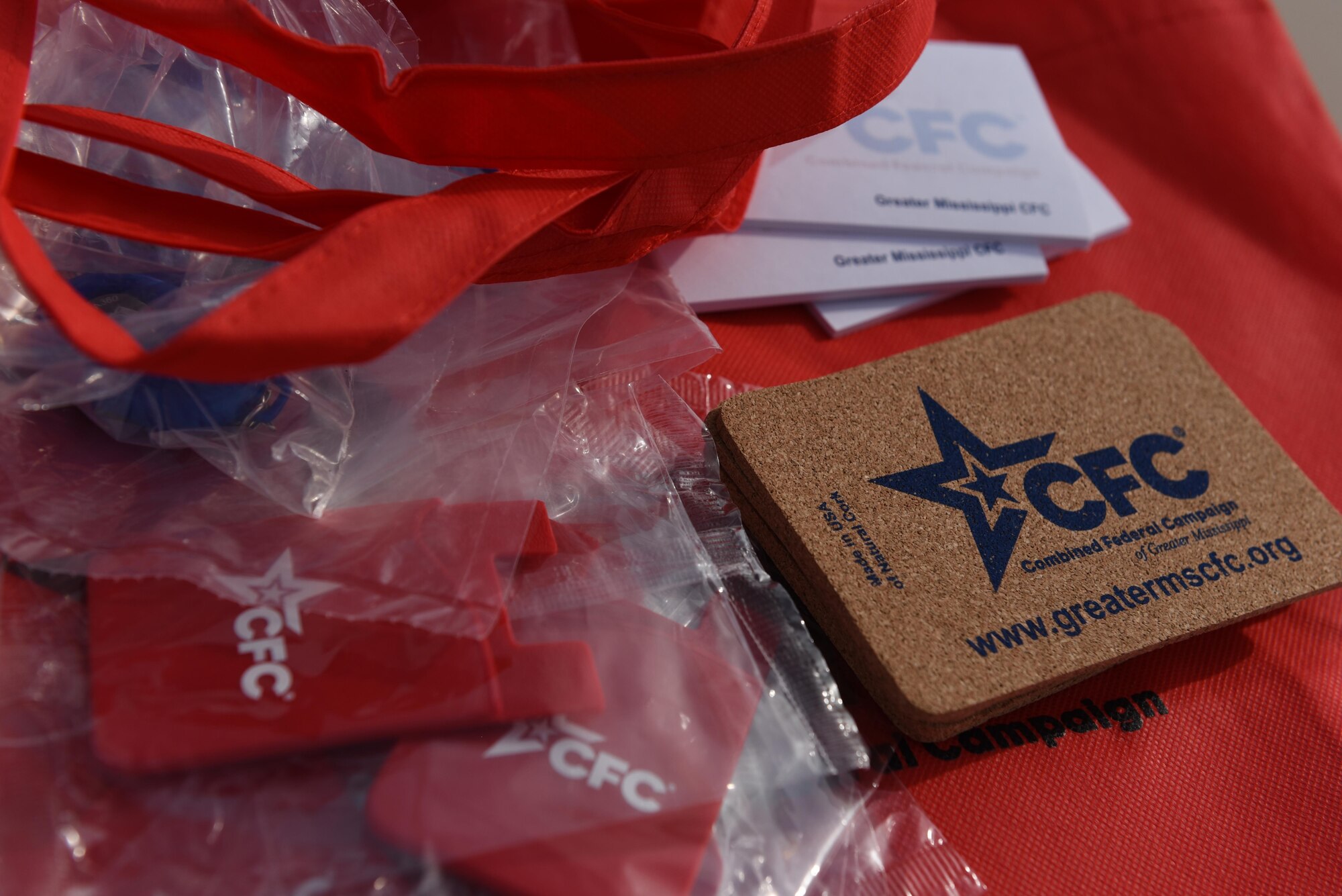 Combined Federal Campaign promotional material sit on a table during the 6th annual Dragon Challenge, Oct. 24, 2015, Keesler Air Force Base, Miss. The Dragon Challenge was Keesler’s Combined Federal Campaign kickoff event. Base sponsors donated money per completed lap by team and solo runners during a 12-hour period. Overall, Team Keesler raised $3,082 for the CFC. (U.S. Air Force photo by Tech. Sgt. Greg Biondo)
