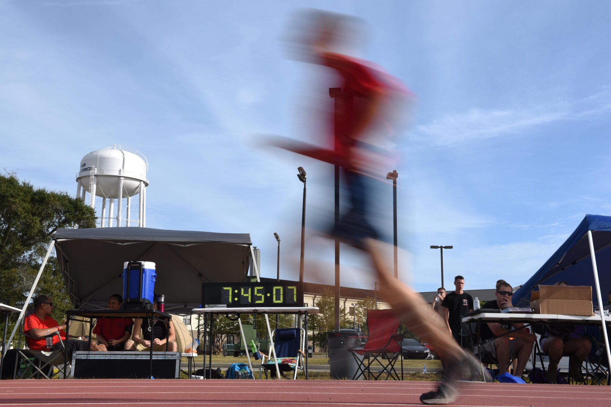 A runner from the 336th Training Squadron finishes a lap during the 6th annual Dragon Challenge, Oct. 24, 2015, Keesler Air Force Base, Miss. The Dragon Challenge was Keesler’s Combined Federal Campaign kickoff event. Base sponsors donated money per completed lap by team and solo runners during a 12-hour period. The 336th TRS came in first place in the team competition completing 152 laps equating to 106.6 miles. (U.S. Air Force photo by Tech. Sgt. Greg Biondo)