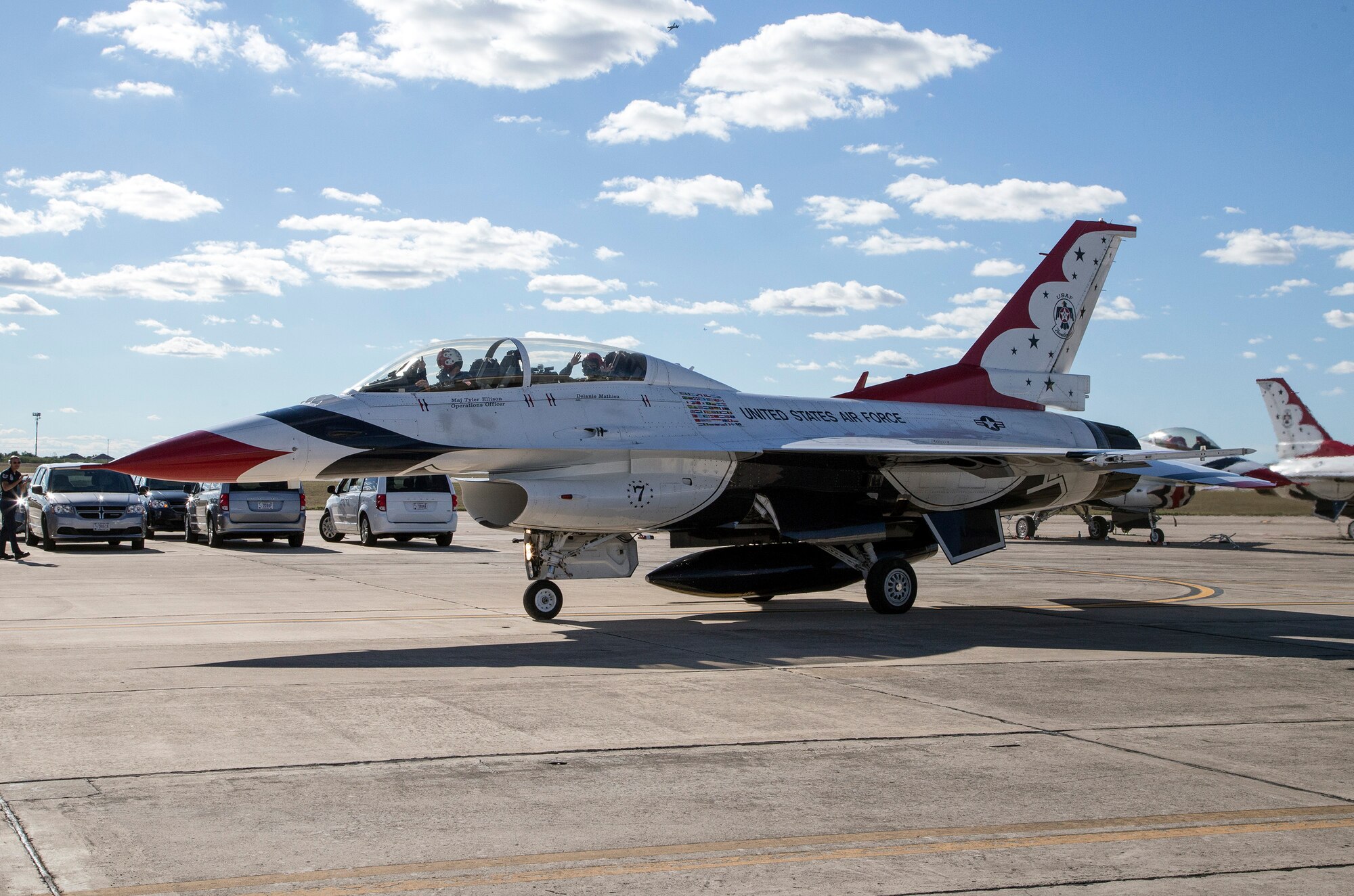 Maj. Tyler Ellison, U.S. Air Force Air Demonstration Squadron "Thunderbirds" operations officer, prepares to depart with passenger Delaine Mathieu, News 4 San Antonio co-anchor, for a media flight Oct. 26, 2015 at Joint Base San Antonio-Randolph, Texas. The Thunderbirds are performing in the 2015 Air Show and Open House at JBSA- Randolph to be held Oct. 31 and Nov. 1. (U.S. Air Force photo by Johnny Saldivar/Released)