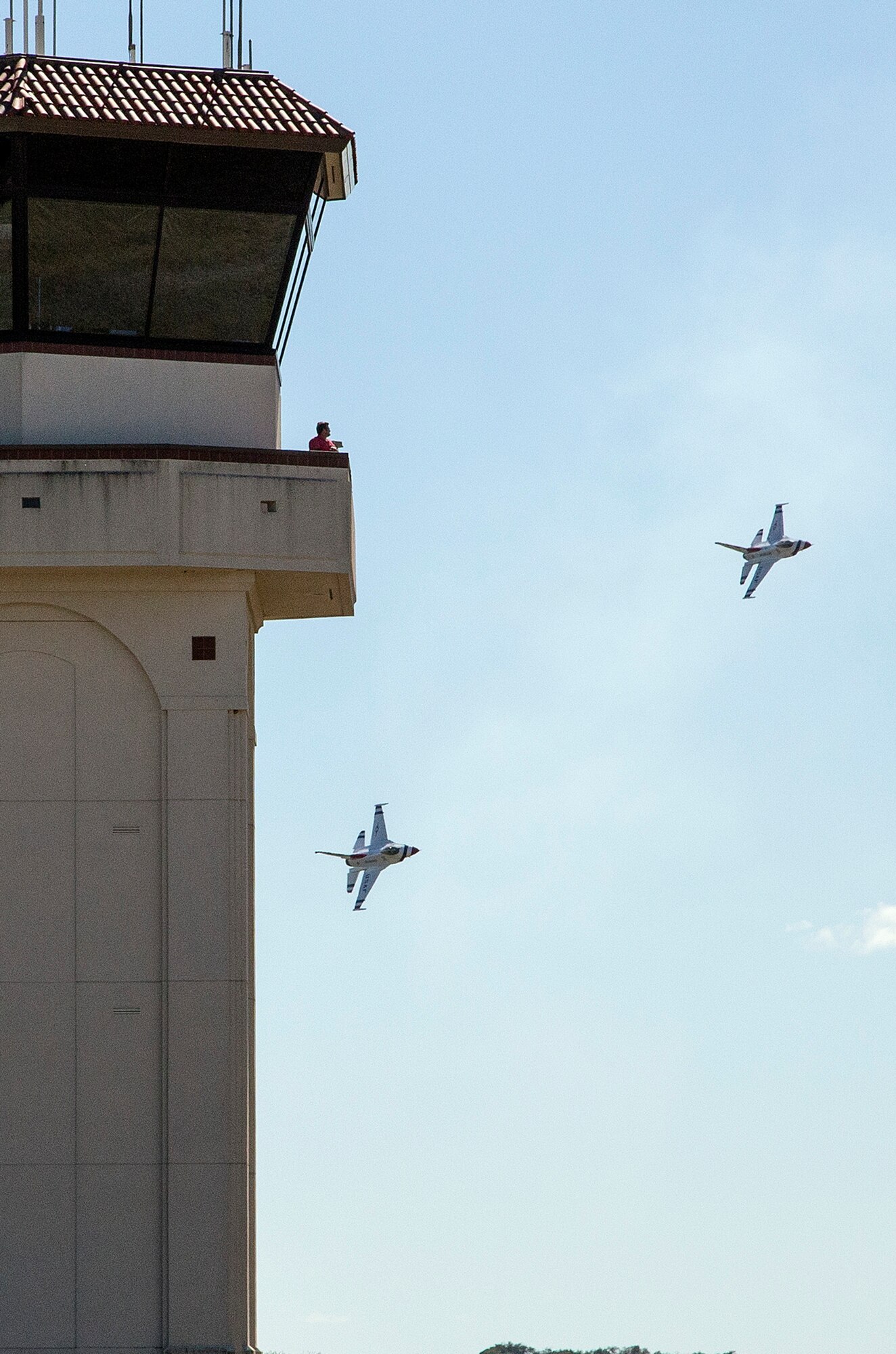 The U.S. Air Force Aerial Demonstration Squadron “Thunderbirds” practice performing F-16 acrobatic maneuvers Oct. 26, 2015 at Joint Base San Antonio-Randolph, Texas. The Thunderbirds team members arrived in preparation for the 2015 JBSA-Randolph Air Show and Open House to be held Oct. 31 and Nov. 1.  Air shows allow the Air Force to display the capabilities of our aircraft to the American taxpayer through aerial demonstrations and static displays and allowing attendees to get up close and personal to see some of the equipment and aircraft used by the U.S. military today.  (U.S. Air Force photo by Johnny Saldivar/Released)