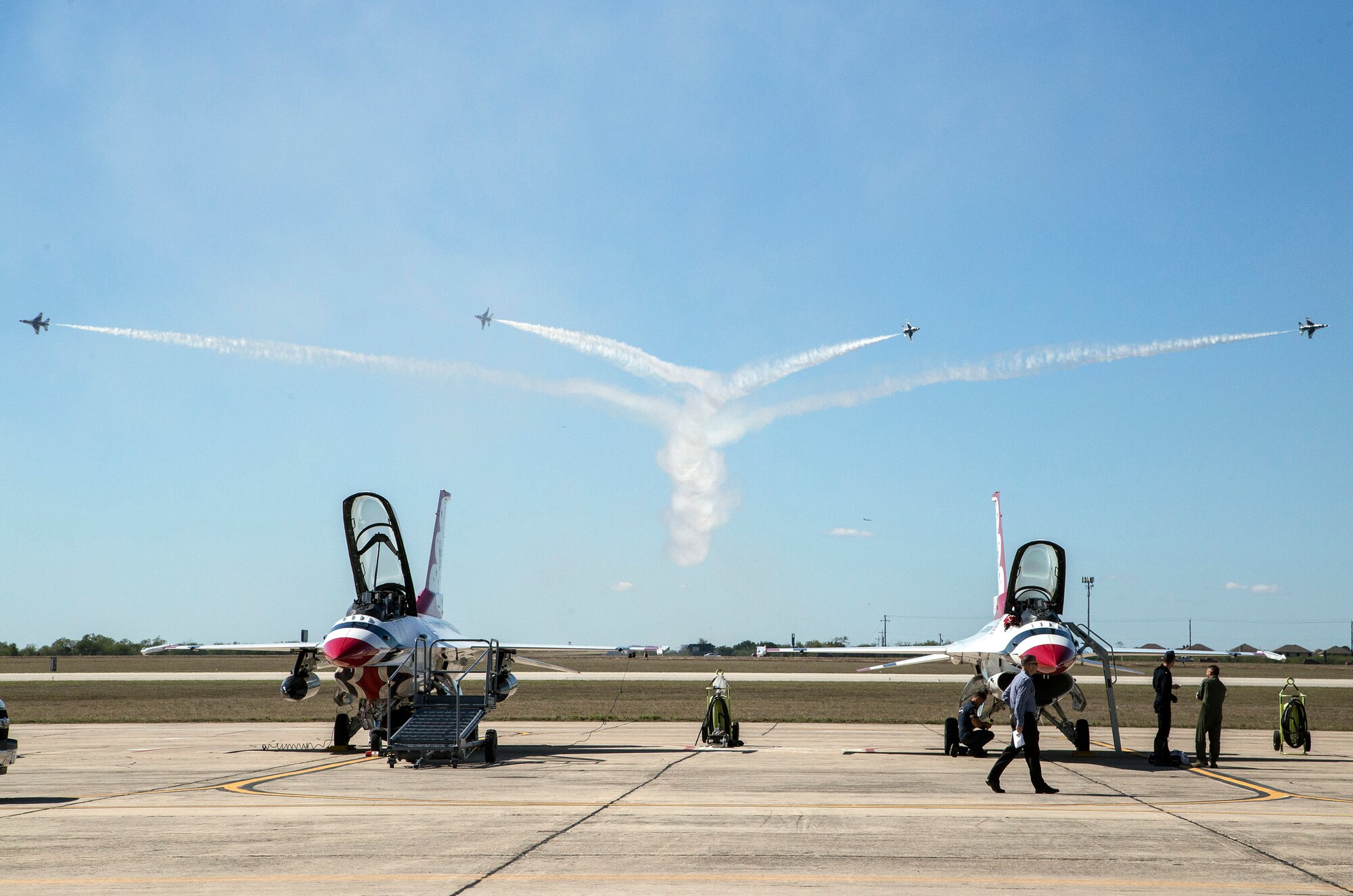 The U.S. Air Force Aerial Demonstration Squadron “Thunderbirds” practice performing F-16 acrobatic maneuvers Oct. 26, 2015 at Joint Base San Antonio-Randolph, Texas. The Thunderbirds team members arrived in preparation for the 2015 JBSA-Randolph Air Show and Open House to be held Oct. 31 and Nov. 1.  Air shows allow the Air Force to display the capabilities of our aircraft to the American taxpayer through aerial demonstrations and static displays and allowing attendees to get up close and personal to see some of the equipment and aircraft used by the U.S. military today.  (U.S. Air Force photo by Johnny Saldivar/Released)