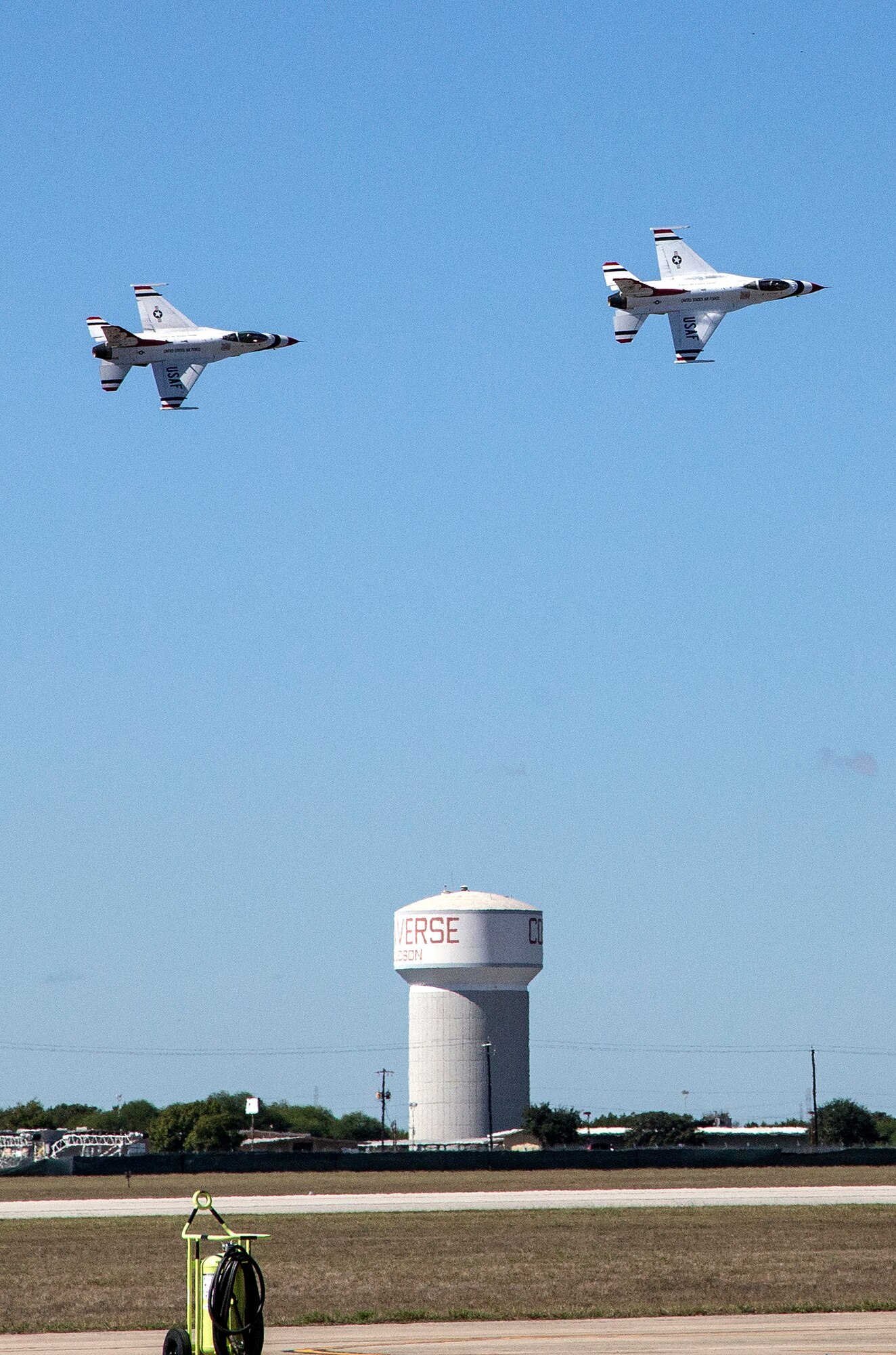 The U.S. Air Force Aerial Demonstration Squadron “Thunderbirds” practice performing F-16 acrobatic maneuvers Oct. 26, 2015 at Joint Base San Antonio-Randolph, Texas. The Thunderbirds team members arrived in preparation for the 2015 JBSA-Randolph Air Show and Open House to be held Oct. 31 and Nov. 1.  Air shows allow the Air Force to display the capabilities of our aircraft to the American taxpayer through aerial demonstrations and static displays and allowing attendees to get up close and personal to see some of the equipment and aircraft used by the U.S. military today.  (U.S. Air Force photo by Johnny Saldivar/Released)