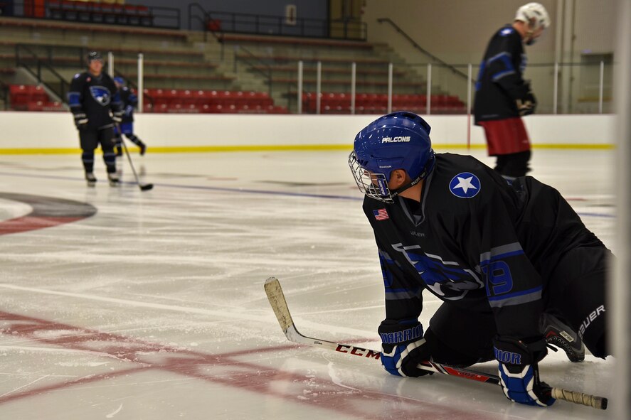 Master Sgt. Richard Ortega, Falcons vice president, stretches prior to the Blue and White Game Oct. 23, 2015, at Eastern Washington University’s Recreation Center ice rink. The Falcons were formed in 2013 and have Blue and White games in October and March of every season. (U.S. Air Force photo/Airman 1st Class Mackenzie Richardson)