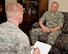 Chief Master Sgt. of the Air Force James A. Cody shares insight about Air Force issues with Airman 1st Class Curt Beach, 2nd Bomb Wing Public Affairs photojournalist, at Barksdale Air Force Base, La., Oct. 22, 2015. Cody represents the highest enlisted level of leadership, and as such, provides direction for the enlisted force and represents their interests, as appropriate, to the American public, and to those in all levels of government. (U.S. Air Force photo/Airman 1st Class Mozer O. Da Cunha) 