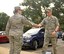 Tech. Sgt. Marie Brown, 2nd Bomb Wing Public Affairs photojournalist, greets Chief Master Sgt. of the Air Force James A. Cody at Barksdale Air Force Base, La., Oct. 22, 2015. Cody serves as the personal adviser to the Chief of Staff and the Secretary of the Air Force on all issues regarding the welfare, readiness, morale, and proper utilization and progress of the enlisted force. (U.S. Air Force photo/Airman 1st Class Mozer O. Da Cunha) 