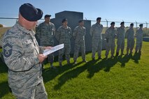 Senior Master Sgt. Douglas F. Clayton, 75th Security Forces Squadron, reads a U.S. Forest Service letter of recognition to 75th SFS Airmen at Hill Air Force Base, Utah, Oct. 26, 2015. The Airmen, military working dog handlers, were training with the Forest Service in the Uinta-Wasatch-Cache National Forest when an emergency medical call was received. To aid an injured person, they carried packs, a litter and other supplies more than two miles at elevations of 7,500 feet. Once at the scene, they coordinated a safe landing for an emergency helicopter and then carried the victim to the helicopter via an extremely narrow trail with steep drop-offs. (U.S. Air Force photo by Alex R. Lloyd)