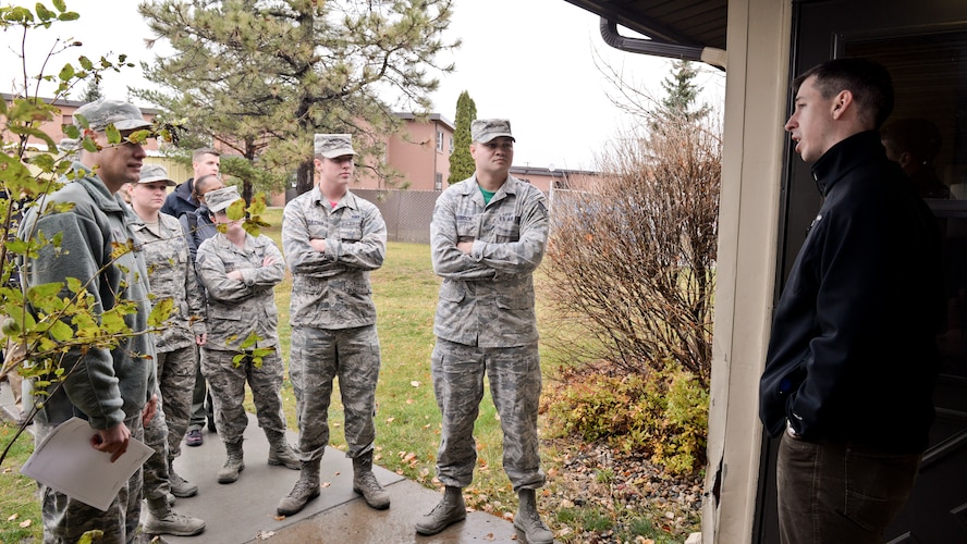 An Office of Special Investigations agent speaks to Public Affairs photojournalists at Minot Air Force Base, N.D., Oct. 22, 2015. OSI agents led training to share their process for photographing a crime scene. (U.S. Air Force photo/Airman 1st Class J. T. Armstrong)