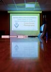 The Office of Special Investigations presents a slide show on crime scene photography at Minot Air Force Base, N.D., Oct. 22, 2015. OSI agents led training to share their process for photographing a crime scene. (U.S. Air Force photo/Airman 1st Class J. T. Armstrong)