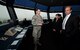 A 52nd Operations Support Squadron air traffic controller gives a tour of the Spangdahlem air traffic control tower to Randolph Stich, Rhineland-Palatinate deputy minister of the interior and Elena Mazzola, German department liaison of military forces Oct. 22, 2015, at Spangdahlem Air Base, Germany.  The tower stands nearly 150 feet tall and serves as a hub for air traffic controllers directing the 52nd Fighter Wing’s aircraft and other aircraft in its air zone. (U.S. Air Force photo by Staff Sgt. Christopher Ruano/Released)