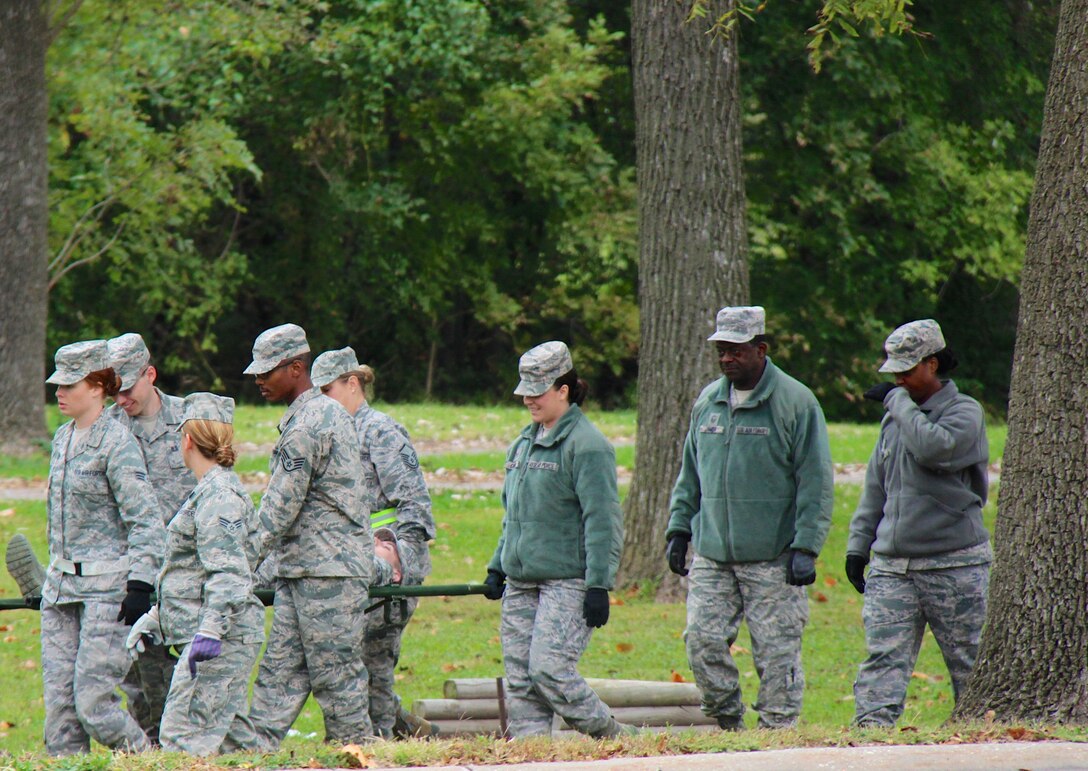 Air Force Reserve Command members of the 932nd Airlift Wing's 932nd Medical Group, including emergency management technicians (EMT), came together to overcome transportation challenges carrying simulated patients on litters through outdoor obstacles.  The basic life saving skills refresher was designed to get experience loading an ambulatory bus out near the Scott Lake wooded area where some of the training occurred. They also worked in the medical building at the unit and attended refresher classes several days. (U.S. Air Force photo by Maj. Stan Paregien)