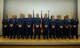The graduating class 16-1 of the base Honor Guard’s training course pose for a photo after their graduation ceremony inside the base theater at Spangdahlem Air Base, Germany, Oct. 23, 2015. Twelve of the original 20 recruits completed and graduated the ceremony after five days of training. (U.S. Air Force photo by Airman 1st Class Timothy Kim/Released)