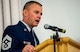 U.S. Air Force Chief Master Sgt. Brian Gates, 52nd Fighter Wing command chief, speaks during the base Honor Guard training graduation ceremony inside the base theater at Spangdahlem Air Base, Germany, Oct. 23, 2015. The graduates received badges which represents their obligation to be ready at a moment’s notice to render military honors. (U.S. Air Force photo by Airman 1st Class Timothy Kim/Released)