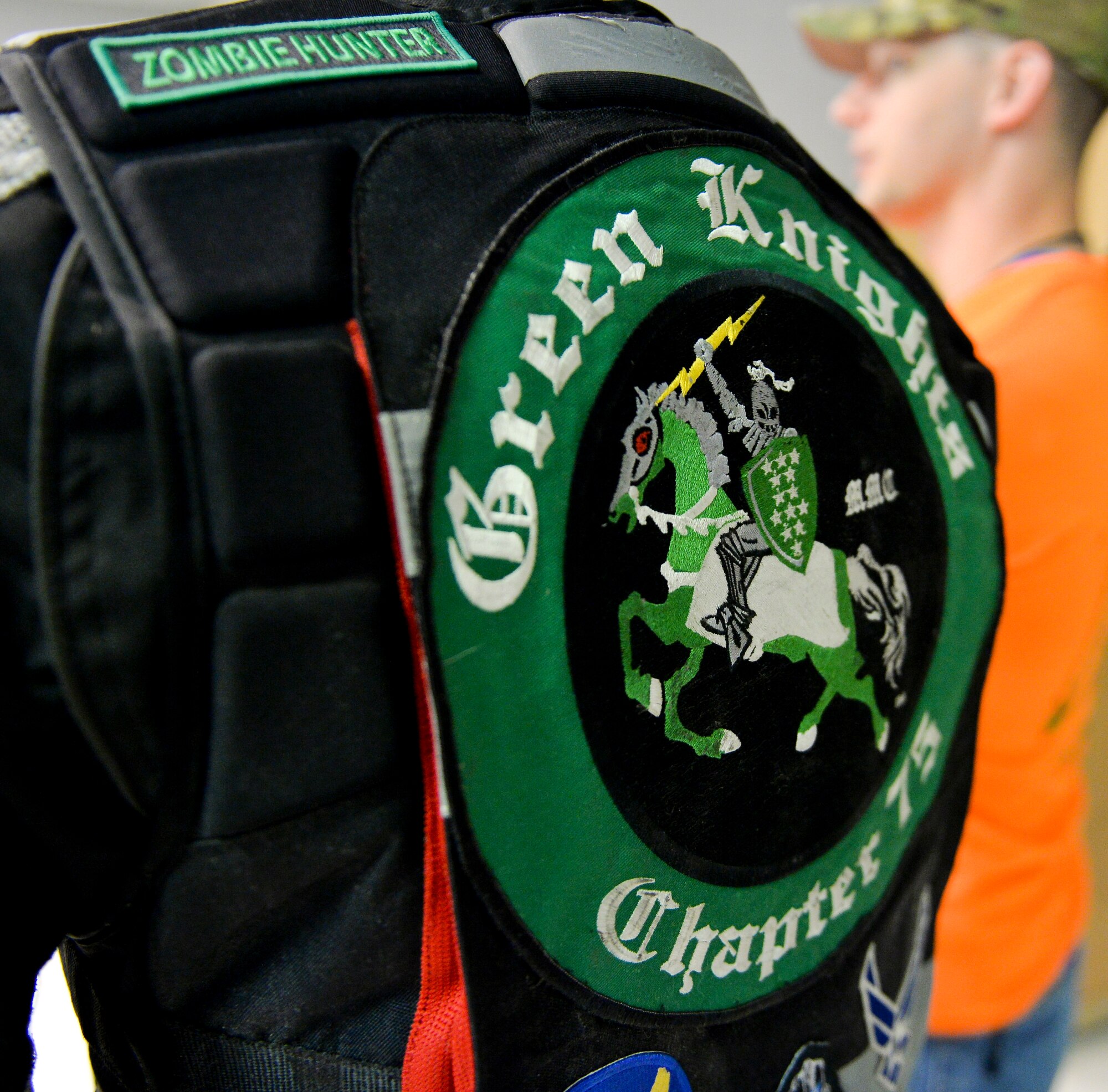 A patched member from the Green Knights Motorcycle Club Chapter 75 attend a safety briefing, kicking off the fourth annual Cajun Rumble at Barksdale Air Force Base, La., Oct. 23, 2015. The first chapter of the Green Knights was formed in 1999, and today there are more than 105 chapters worldwide. (U.S. Air Force photo/Airman 1st Class Mozer O. Da Cunha)