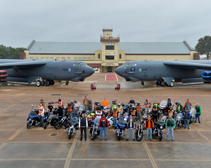 Motorcyclists pose for a group photo in front of two B-52 Stratofortresses on Barksdale Air Force Base, La., Oct. 23, 2015. More than 30 riders gathered for a safety brief and group photo celebrating the fourth annual Cajun Rumble hosted by the Green Knights Motorcycle Club Chapter 75. (U.S. Air Force photo/Airman 1st Class Mozer O. Da Cunha)