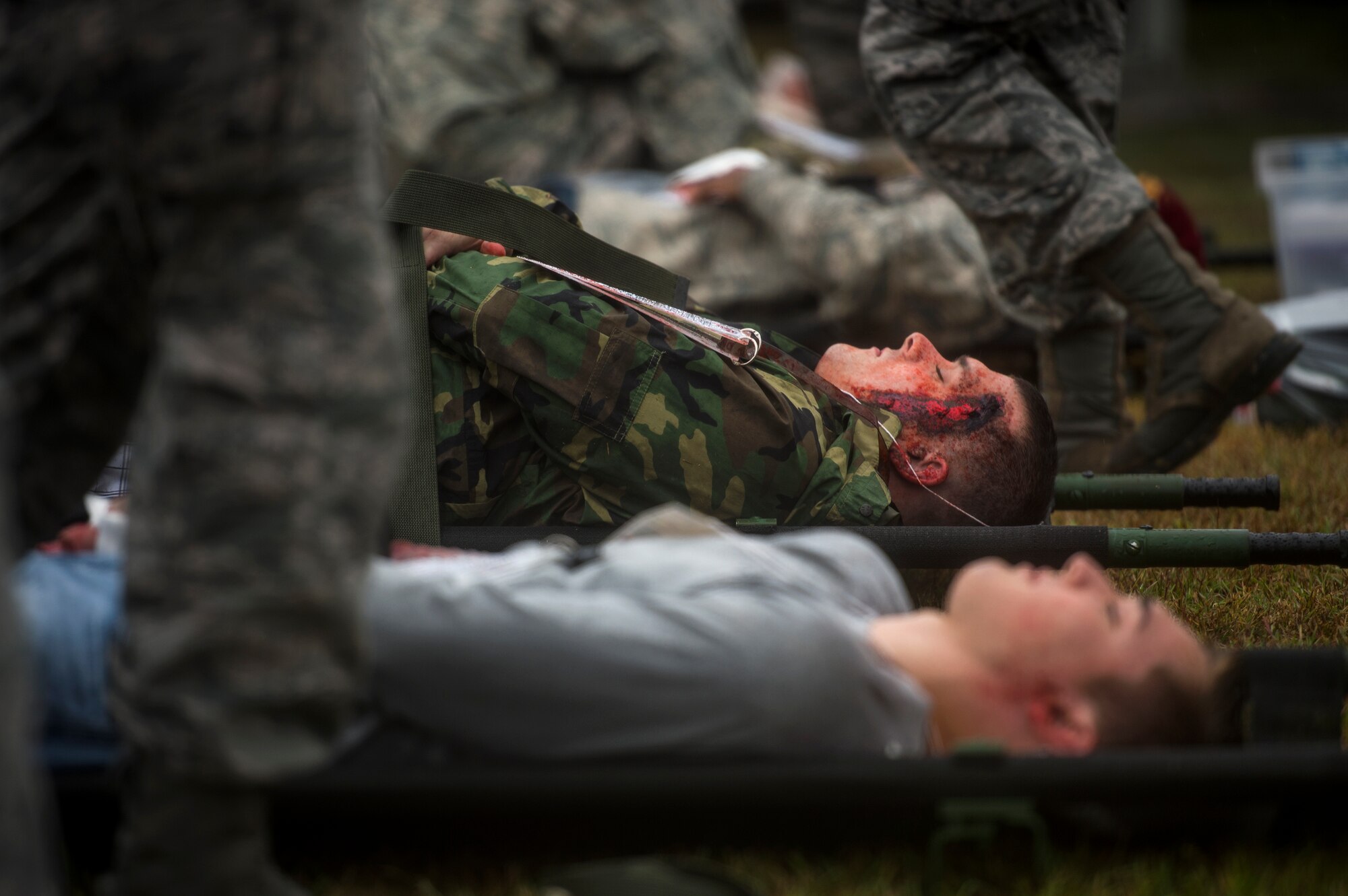 Patients are lined up before being transported to a medical facility during a major accident response exercise, Oct. 27, 2015, at Moody Air Force Base, Ga. Airmen in the exercise simulated symptoms correlating with varying injuries which may be received in an aircraft crash. (U.S. Air Force photo by Senior Airman Ryan Callaghan/Released)

