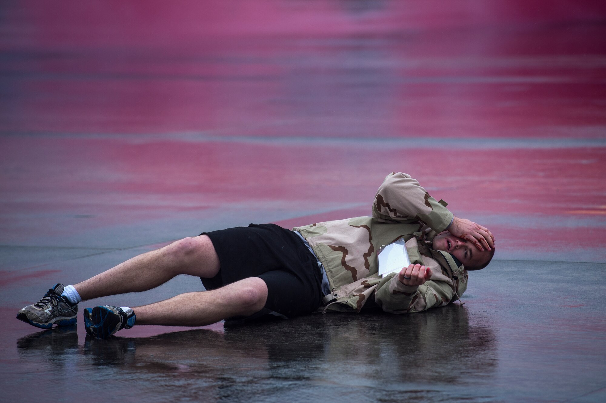 An Airman plays the role of a victim after a simulated aircraft crash during a major accident response exercise, Oct. 27, 2015, at Moody Air Force Base, Ga. The scenario for the exercise involved a demonstration aircraft crashing into a crowd of spectators during an airshow. (U.S. Air Force photo by Senior Airman Ryan Callaghan/Released)
