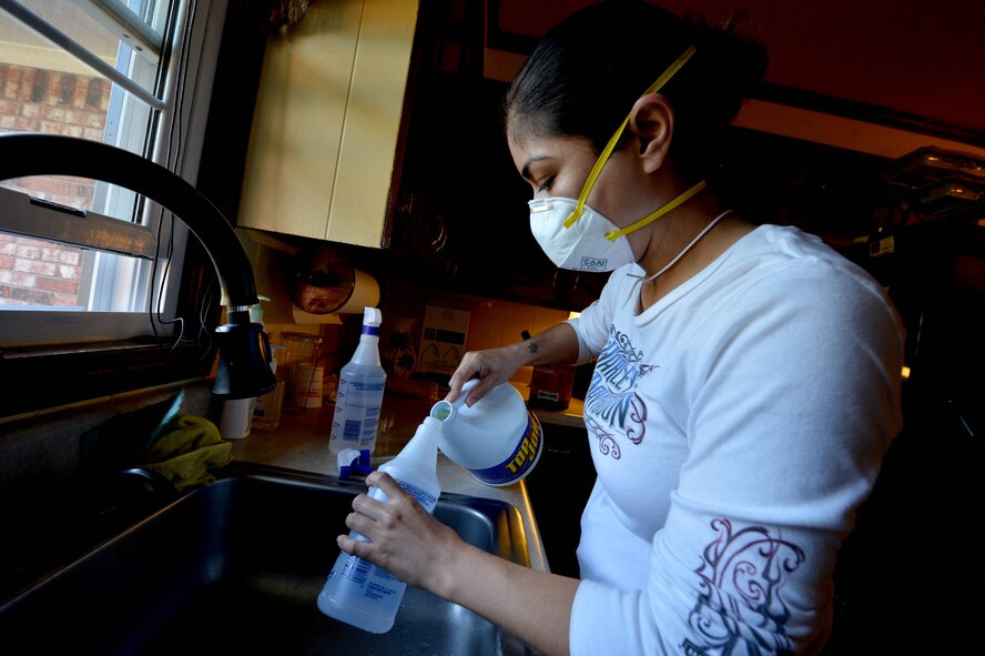A U.S. Air Force Airman assigned to the 20th Fighter Wing pours bleach into a spray bottle during disaster relief efforts in Sumter, S.C., Oct. 17, 2015. To ensure the homes affected by the flood were free of mold, volunteers sprayed the remaining wood with a bleach and water blend. (U.S. Air Force photo by Senior Airman Diana M. Cossaboom/Released)