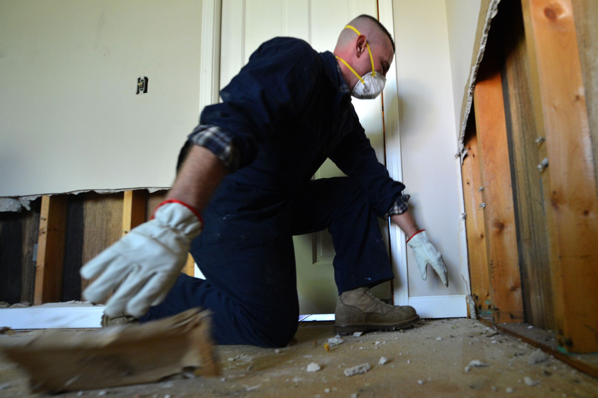 U.S. Air Force Senior Master Sgt. Johnny Hamm, U.S. Air Forces Central Command first sergeant, pulls out moldy baseboards during a disaster relief effort in Sumter, S.C., Oct. 17, 2015. The flood, caused by the storm resulting from Hurricane Joaquin, affected approximately 600 homes in Sumter. (U.S. Air Force photo by Senior Airman Michael Cossaboom/Released)