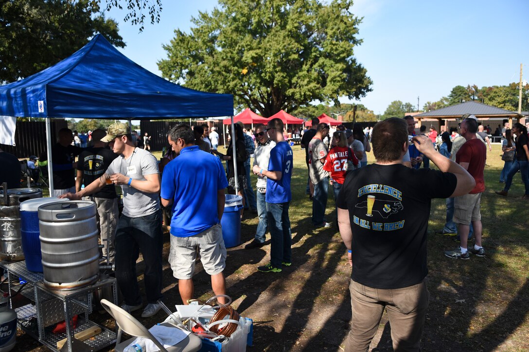 Members of Team Seymour attend the inaugural Oktobrewfest event Oct. 24, 2015, at Seymour Johnson Air Force Base, North Carolina. More than 400 people attended the event, which was organized by the SJ Home Brew Club. (U.S. Air Force photo/Senior Airman Aaron J. Jenne)