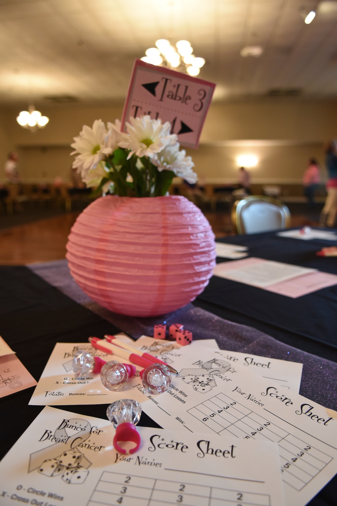 The Officers and Civilian Spouses Club and the Enlisted Spouses Club host a Bunco for Brest Cancer event Oct. 23, 2015, at Seymour Johnson Air Force Base, North Carolina. The event was designed to raise awareness for breast cancer and contribute to the Combined Federal Campaign. (U.S. Air Force photo/Senior Airman Aaron J. Jenne)