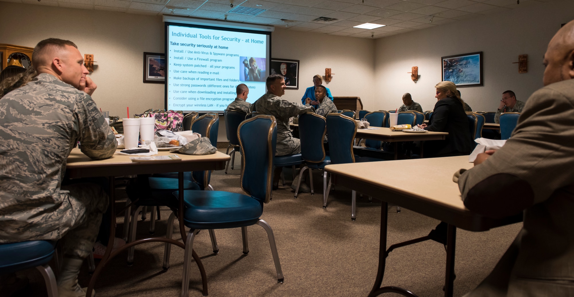 Terry Pobst-Martin, 366th Fighter Wing chief of information security, briefs airmen Oct. 20, 2015 at Mountain Home Air Force Base, Idaho. To celebrate Cyber Security Month, the base hosted Cyber Security Week, open to airmen and their families, to teach safer computer use. (U.S. Air Force photo by Senior Airman Jeremy L. Mosier/ RELEASED)