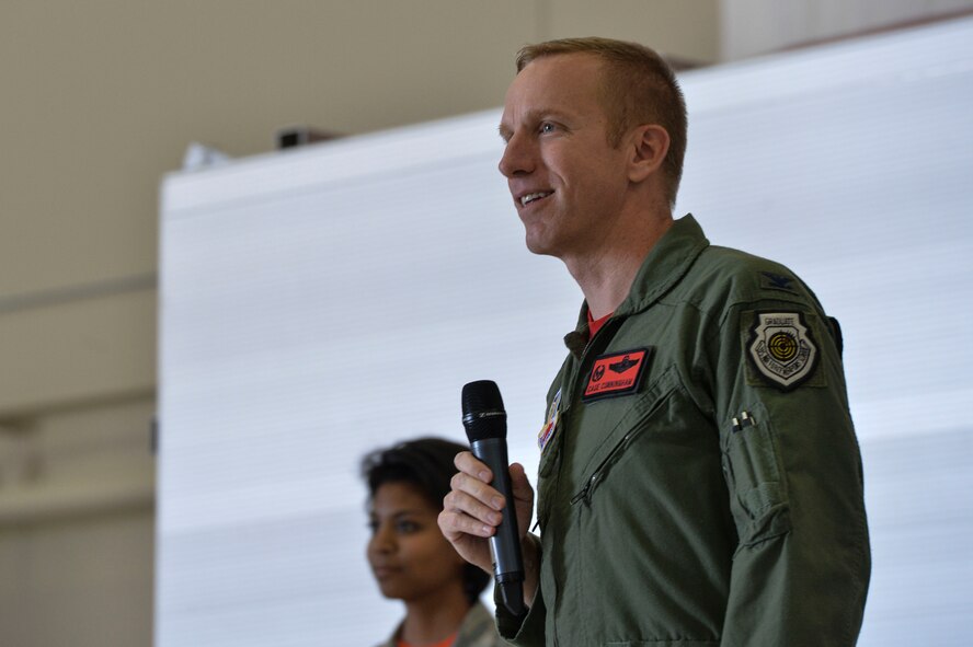 Col. Case Cunningham, 432nd Wing/432nd Air Expeditionary Wing commander addresses staff sergeant selects during the Creech Air Force Base, Nev., NCO Induction Ceremony Oct. 23, 2015. This was the first time Team Creech Airmen were recognized with a formal ceremony aimed at recognizing their achievements while preparing them for their future roles as successful NCOs.  Approximately 50 staff sergeant selects were in attendance. (U.S. Air Force photo by Senior Airman Adarius Petty)