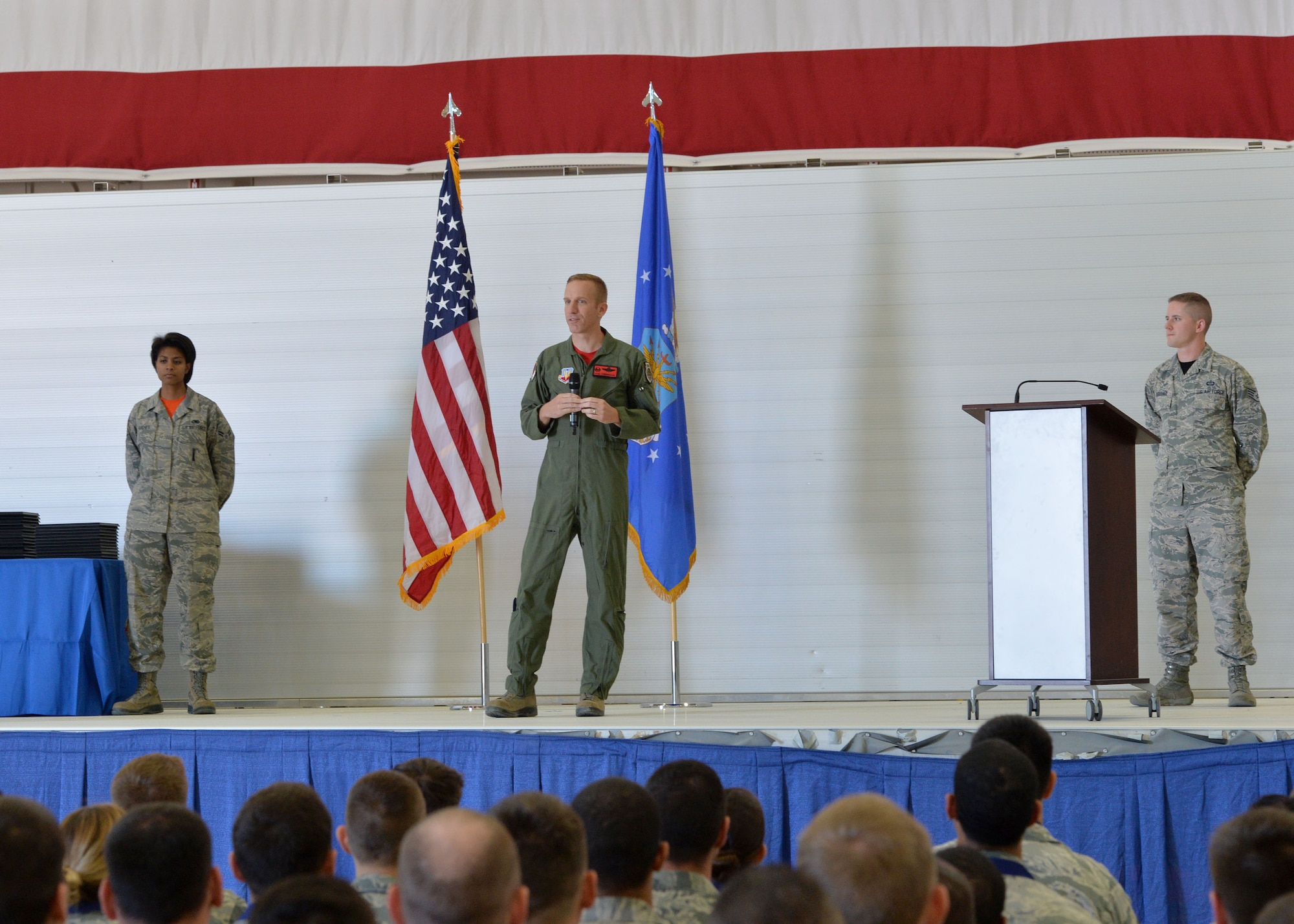 Col. Case Cunningham, 432nd Wing/432nd Air Expeditionary Wing commander addresses staff sergeant selects during the Creech Air Force Base, Nev., NCO Induction Ceremony Oct. 23, 2015. This was the first time Team Creech Airmen were recognized with a formal ceremony aimed at recognizing their achievements while preparing them for their future roles as successful NCOs.  Approximately 50 staff sergeant selects were in attendance. (U.S. Air Force photo by Senior Airman Adarius Petty)