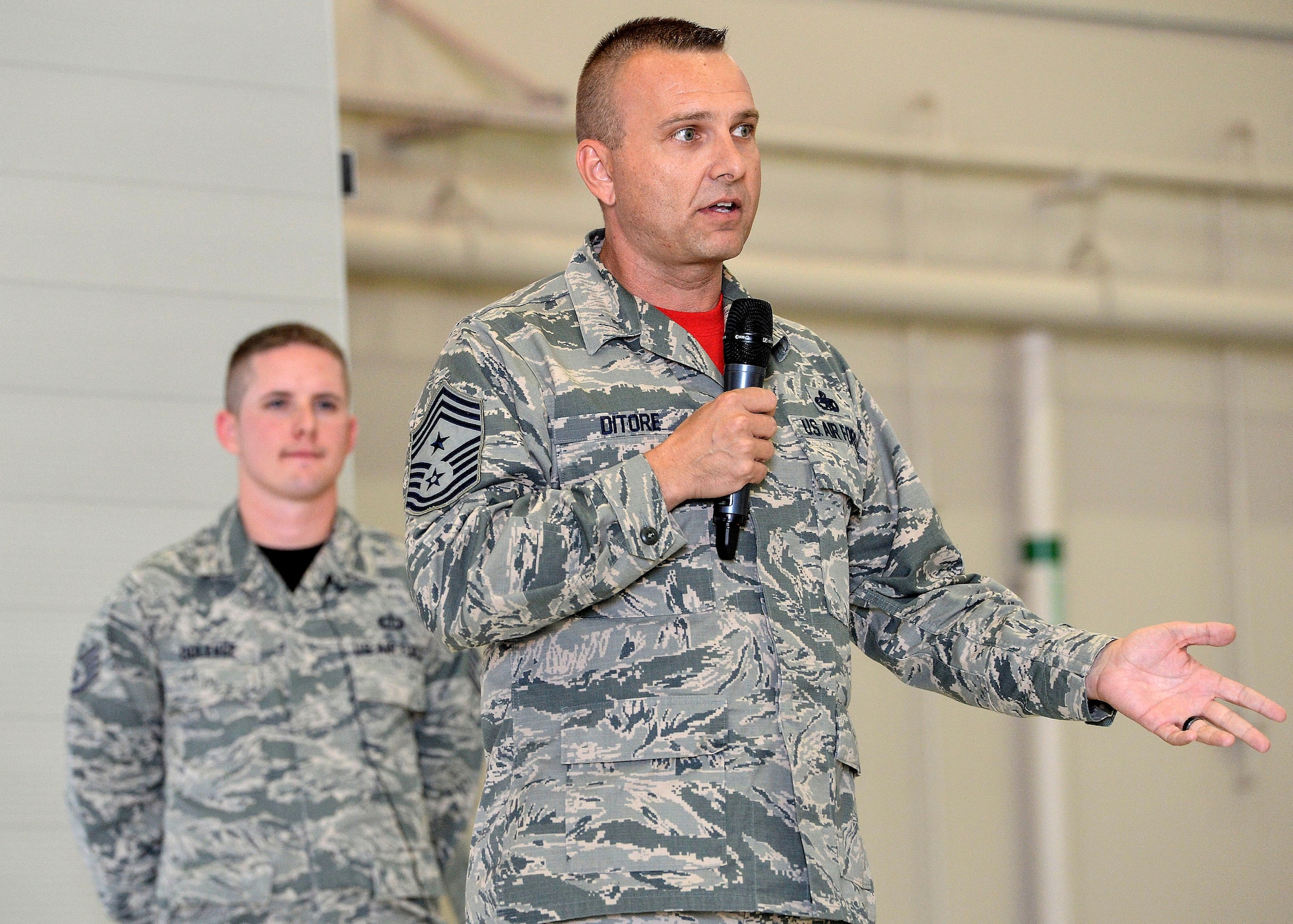 Chief Master Sgt. Michael Ditore, 432nd Wing/432nd Air Expeditionary Wing command chief, addresses staff sergeant selects during the NCO Induction Ceremony at Creech Air Force Base, Nev., Oct. 23, 2015. This was the first time Team Creech Airmen were honored with a formal ceremony aimed at recognizing their achievements while preparing them for their future roles as successful NCOs.  Approximately 50 staff sergeant selects were in attendance. (U.S. Air Force photo by Senior Airman Adarius Petty)