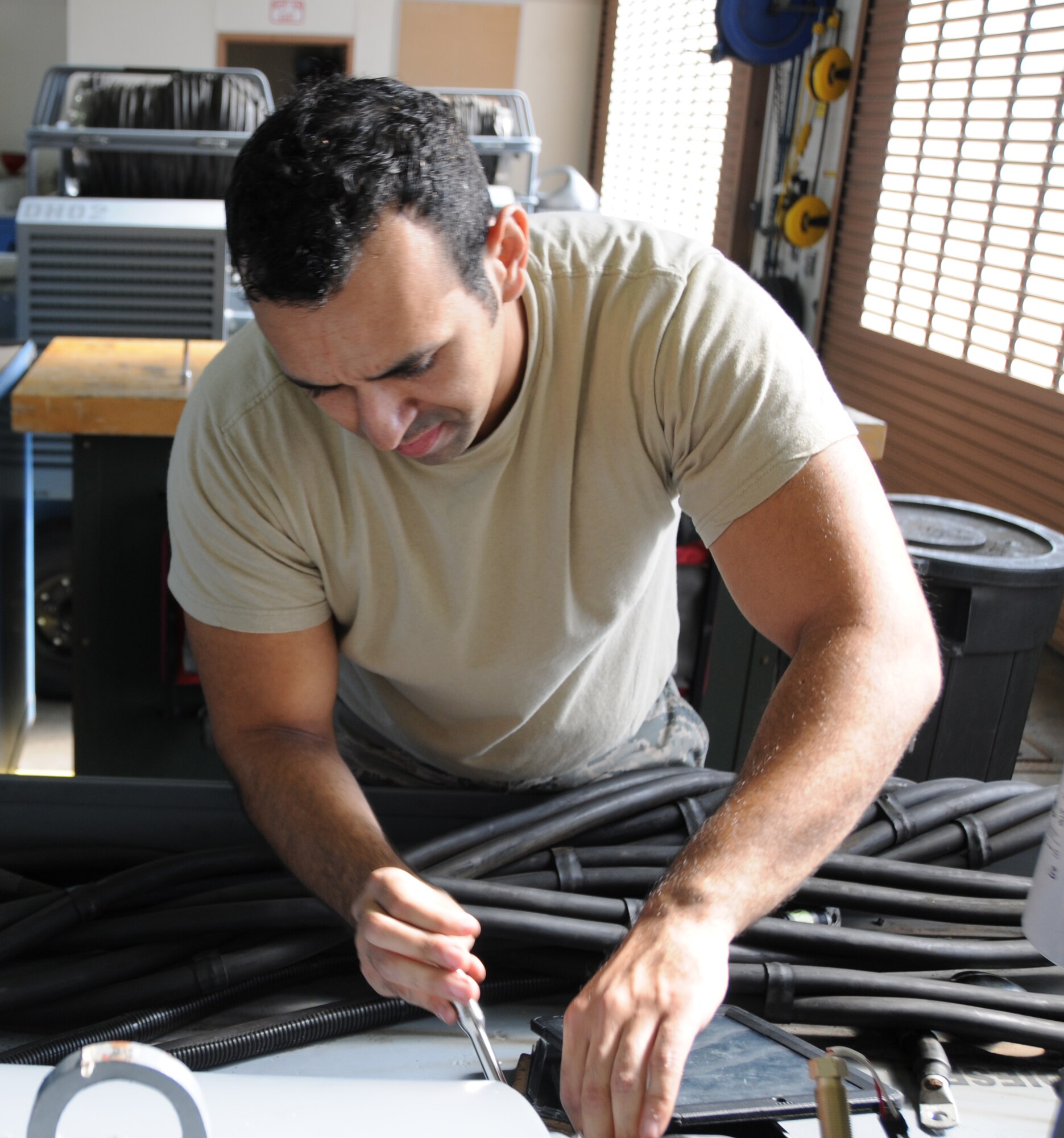 Staff Sgt. Guadalupe Mozart Retana, an aerospace ground equipment apprentice with the 161st Maintenance Group, tightens bolts to secure a diesel engine onto a B809-0108 generator, Oct. 4, at Phoenix Sky Harbor Air National Guard Base.  The B809-0108 generator powers aircraft while on the flight line. Generator power conserves valuable fuel for mission use. (U.S. Air National Guard photo by Tech. Sgt. Michael Matkin)