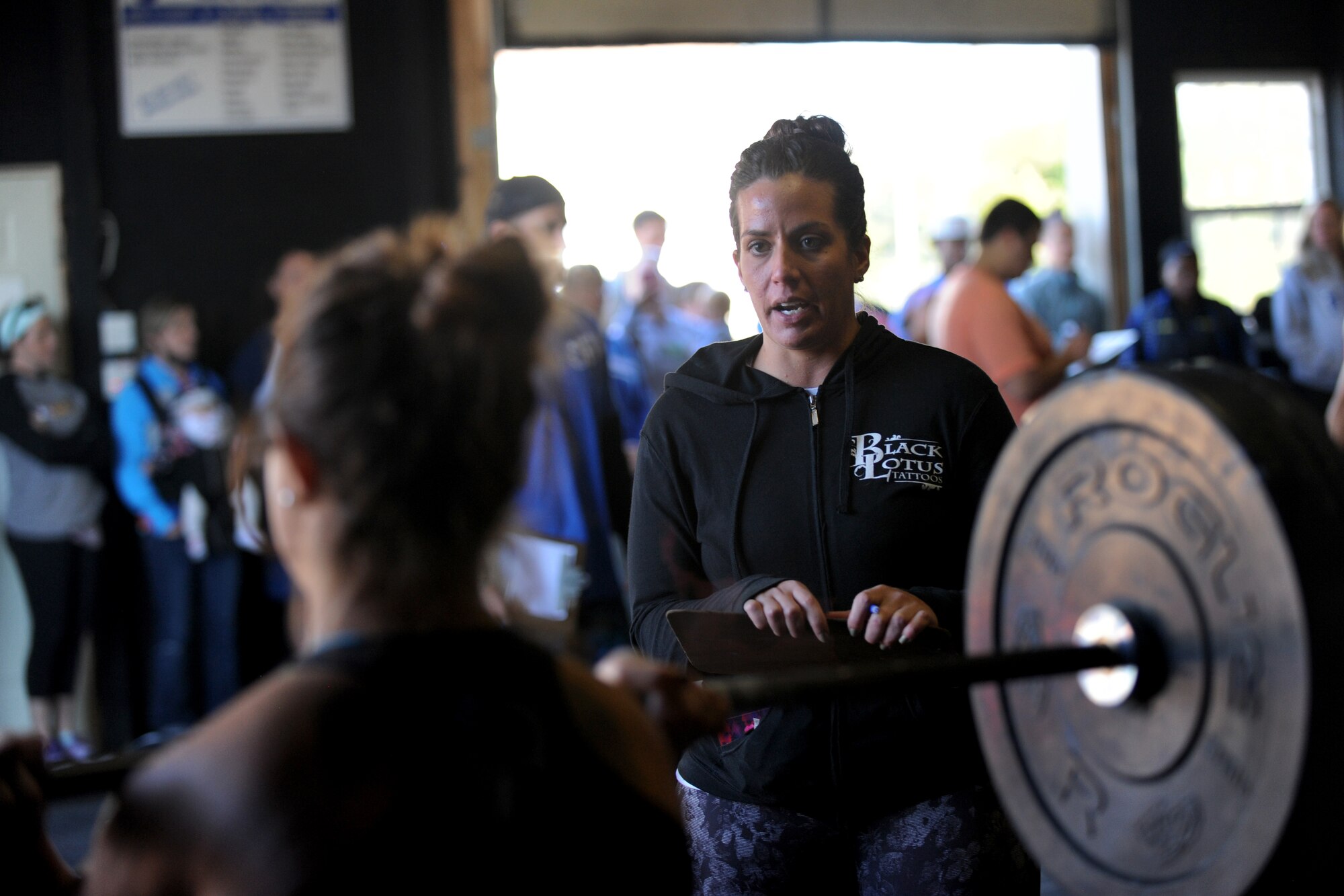 Staff Sgt. Nicole Dudley, 436th Logistics Readiness Squadron unit deployment manager, watches as a competitor of the Eastern Shore Affiliate Challenge performs an exercise Oct. 17, 2015, in Georgetown, Del. Dudley, who also trains at a CrossFit gym, recently became certified to judge and volunteered her time to the event. (U.S. Air Force photo/Staff Sgt. Elizabeth Morris)