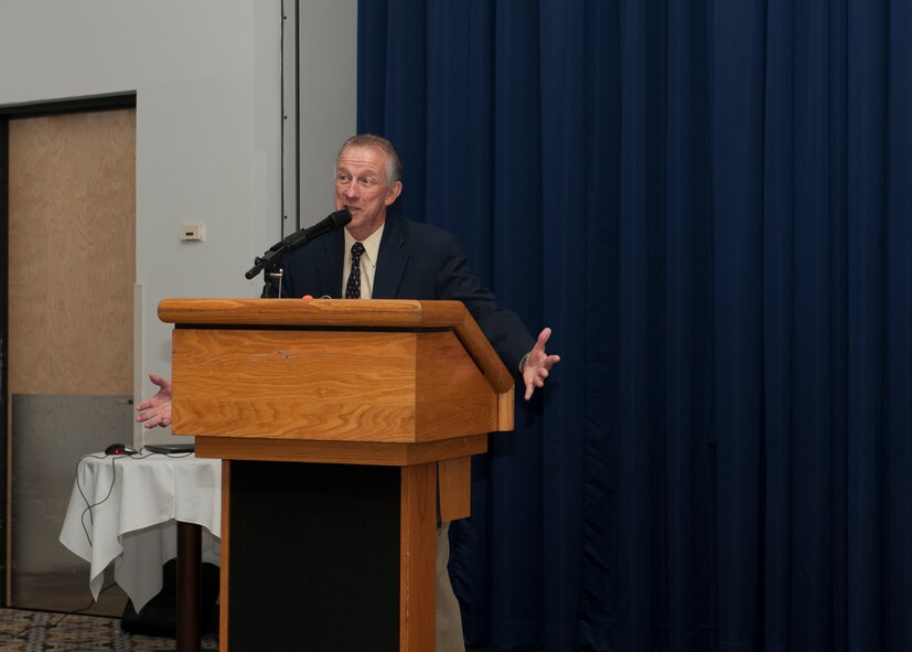 Retired Chief Master Sgt. Jay Darcey speaks at the 2015 Dover Air Force Base Retiree Appreciation Day Oct. 24, 2015, at Dover AFB, Del. Darcey was the emcee for the event. (U.S. Air Force photo/Senior Airman Zachary Cacicia)