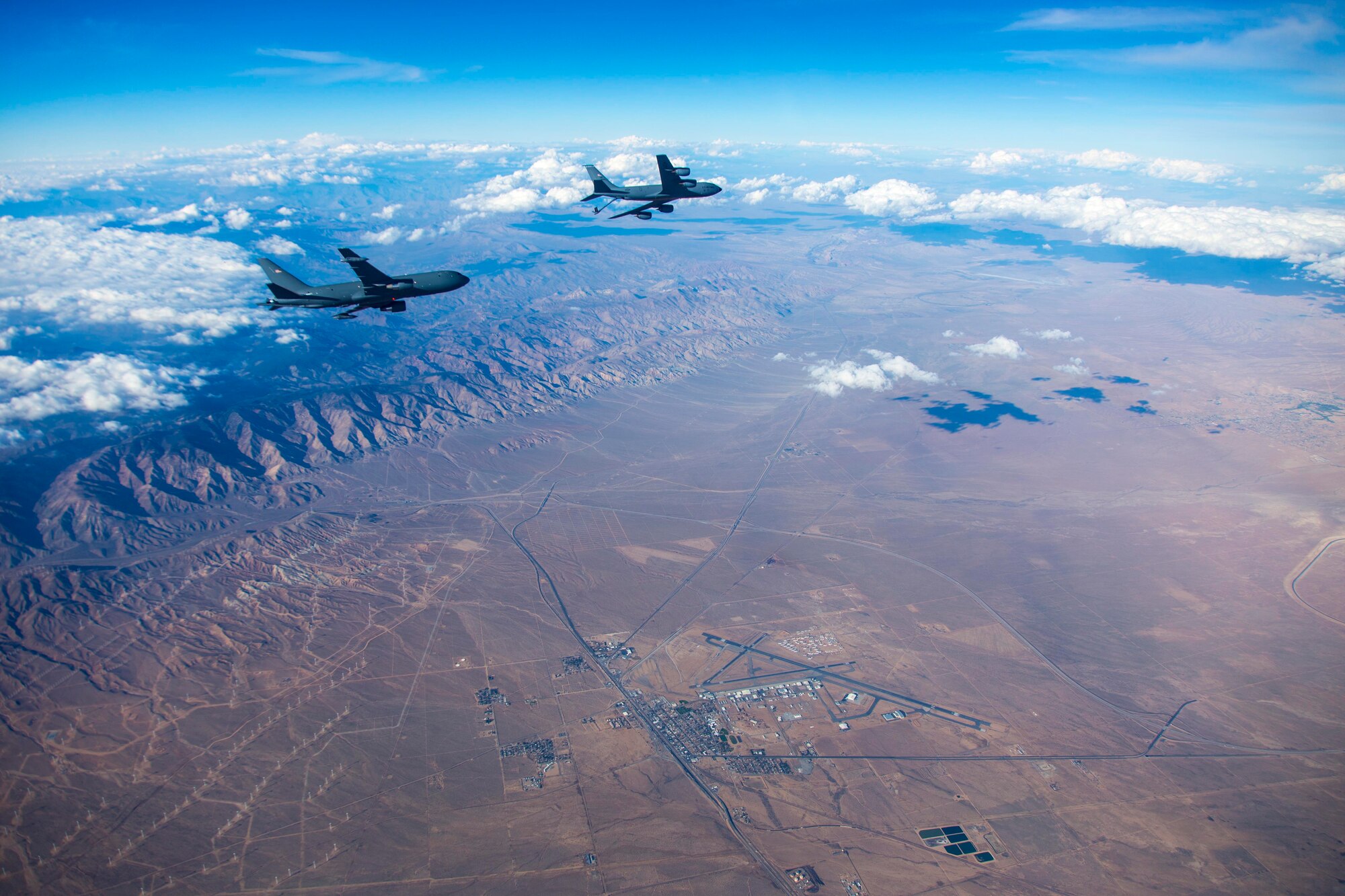 A KC-135 Stratotanker from Fairchild Air Force Base, Boeing and the 418th Flight Test Squadron are conducting Ground Effects and Fuel Onload Fatigue testing on the new KC-46. Fuel Onload Fatigue is gathering data to characterize the aircraft interaction typically experienced when the KC-46A is flying in receiver formation behind a current KC-135 or KC-10 tanker. While the KC-46's role is to refuel other aircraft, it itself may need refuel from other KC-10s or KC-135s to extend its range. Fuel Onload Fatigue testing is the first look at the KC-46 acting in that role. (U.S. Air Force photo/Christopher Okula)