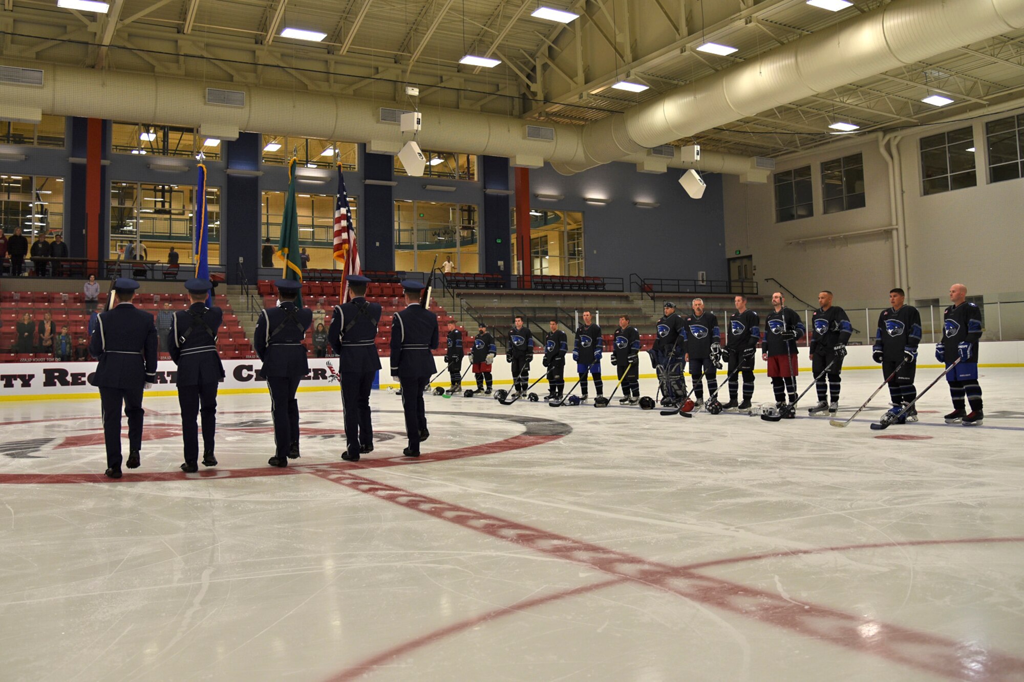 The Fairchild Air Force Base Honor Guard present the colors prior to the Blue and White Game Oct. 23, 2015,  at Eastern Washington University’s Recreation Center ice rink. The Falcons varsity hockey team was split into two separate teams for the scrimmage, blue and white.  (U.S. Air Force photo/Airman 1st Class Mackenzie Richardson)
