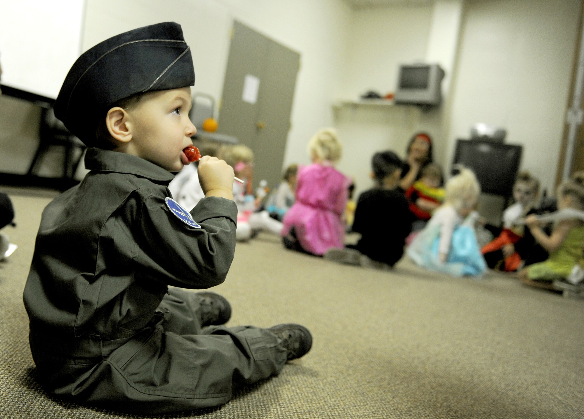 A small child dressed as a U.S. Air Force pilot from the Preschool Co-op Home School Group at Minot Air Force Base, N.D., Oct. 26, 2015. The children participated in a Halloween party during their weekly Co-op meeting which brings children together from different families who are home schooled on Minot AFB. (U.S. Air Force photo by Staff Sgt. Chad Trujillo)