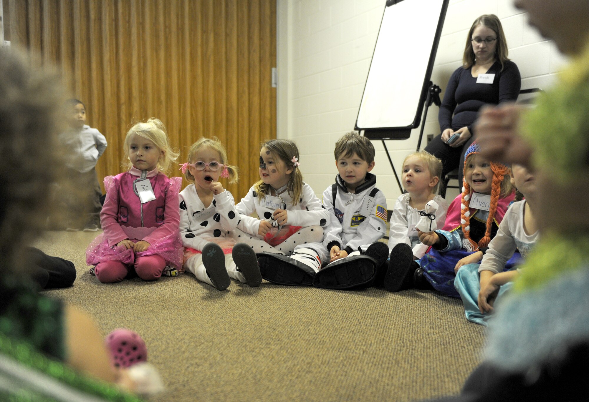 Children from the Preschool Co-op Home School Group listen to their Spanish lesson at Minot Air Force Base, N.D.,  Oct. 26, 2015. The children were participating in a Halloween party during their weekly Co-op meeting which brings children together from different families who are home schooled on Minot AFB. (U.S. Air Force photo by Staff Sgt. Chad Trujillo)