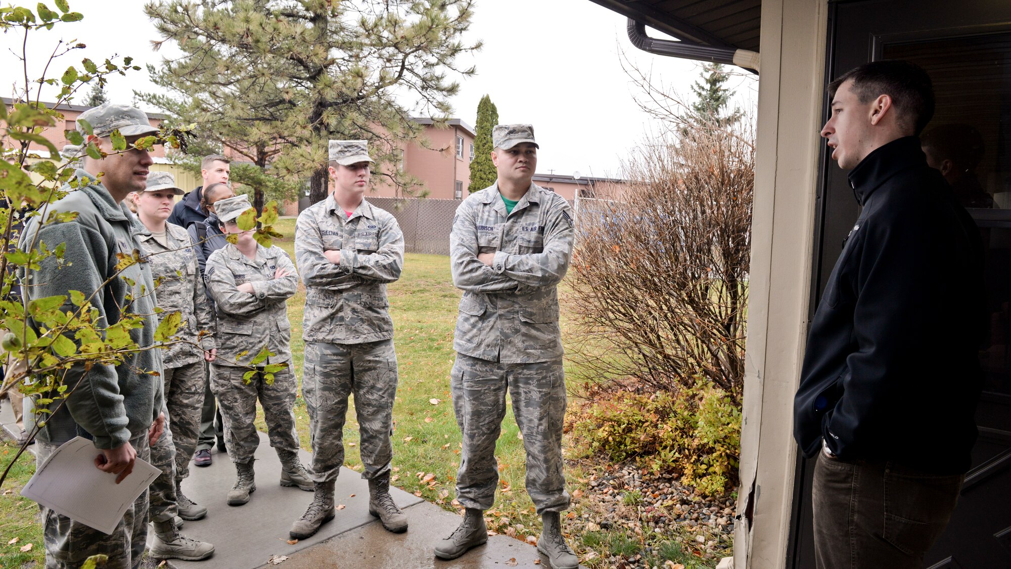 An Office of Special Investigations agent speaks to Public Affairs photojournalists at Minot Air Force Base, N.D., Oct. 22, 2015. OSI agents led training to share their process for photographing a crime scene. (U.S. Air Force photo/Airman 1st Class J. T. Armstrong)