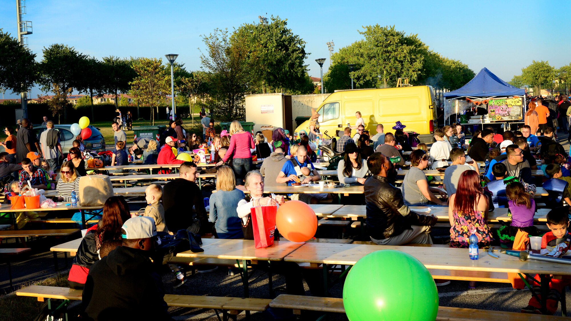 Team Aviano and local community members enjoy “Fall Fest,” Oct. 24, 2015, at Aviano Air Base, Italy. Team Aviano members and the local community came together to celebrate Halloween with children’s games, trick-or-treating, an outdoor movie and a haunted house. (U.S. Air Force photo by Senior Airman Areca T. Bell/Released)