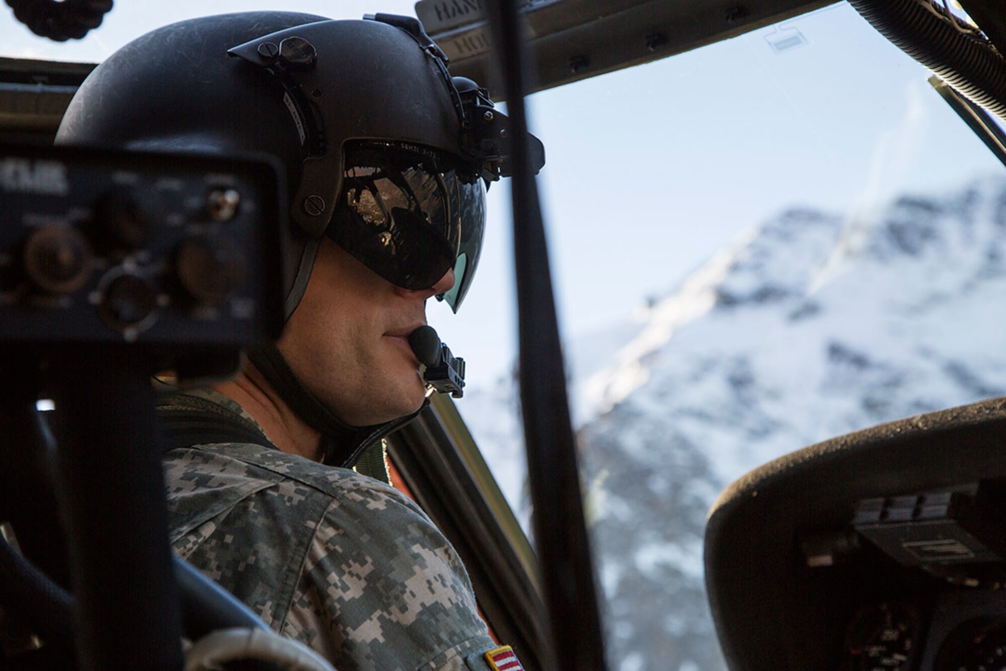 Alaska Army National Guard Chief Warrant Officer 4 Mark Ward, a UH-60 Black Hawk helicopter pilot assigned to 1st Battalion, 207th Aviation Regiment, conducts flight operations over Joint Base Elmendorf-Richardson, Oct. 21, 2015. The flight operations included rescue hoist training and a casualty evacuation exercise with Soldiers assigned to 1st Battalion (Airborne), 501st Infantry Regiment. (U.S. Air Force photo/Alejandro Pena)