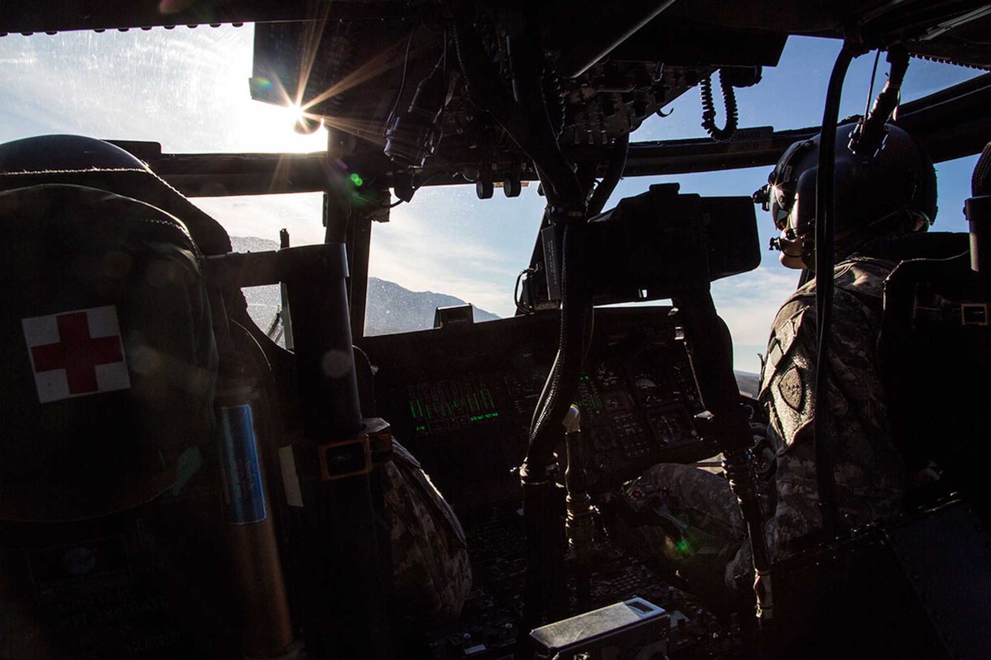 Alaska Army National Guard Capt. Zachary Miller, right, and Chief Warrant Officer 4 Mark Ward, UH-60 Black Hawk helicopter pilots assigned to 1st Battalion, 207th Aviation Regiment, conduct flight operations over Joint Base Elmendorf-Richardson, Alaska, Oct. 21, 2015. The flight operations included rescue hoist training and a casualty evacuation exercise with Soldiers assigned to 1st Battalion (Airborne), 501st Infantry Regiment. (U.S. Air Force photo/Alejandro Pena)